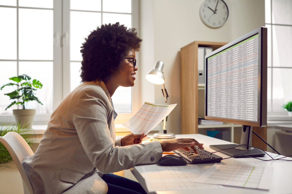 Female accountant working in office, doing her digital record keeping for small business