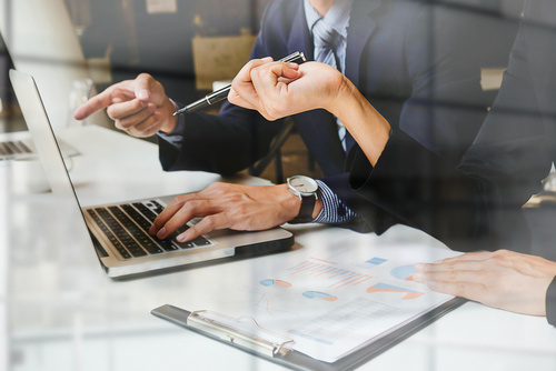 Business owners getting small business bookkeeping services